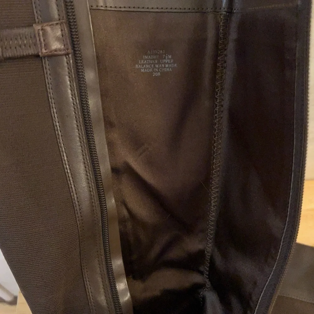 Isaac Mizrahi Live brown leather knee-high riding boots.